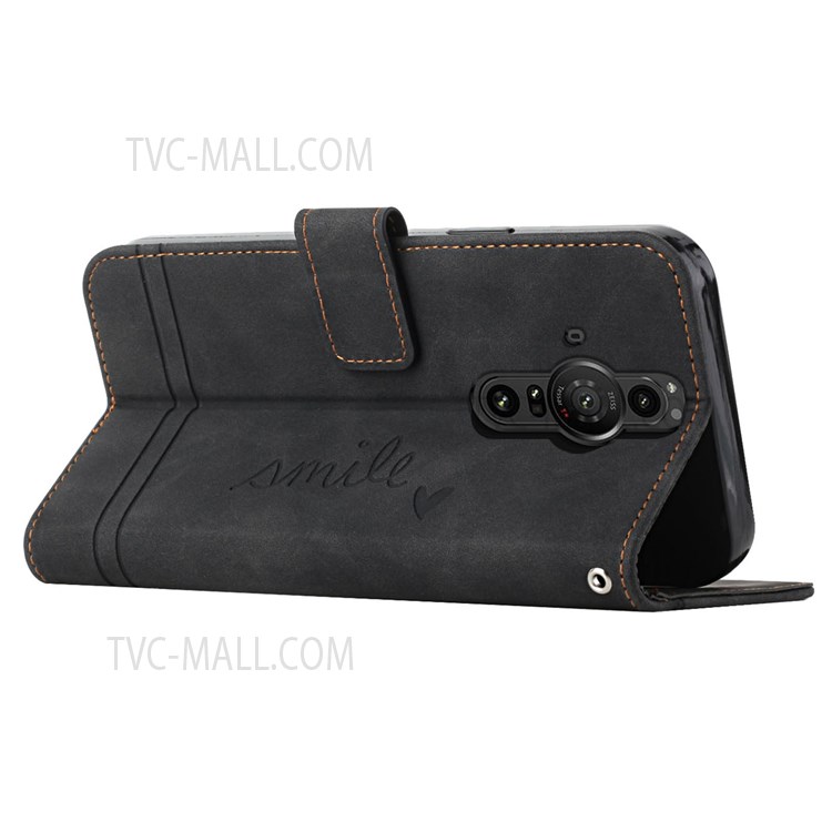 003 Series Wrist Strap TPU+PU Leather Heart Imprinted Magnetic Skin-touch Stand Flip Wallet Phone Case for Sony Xperia Pro-I - Black-5