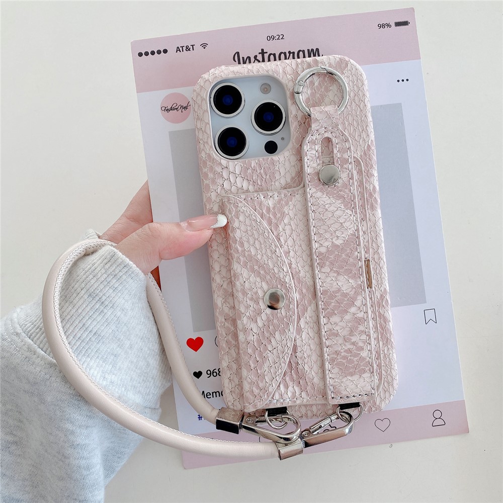 For iPhone 15 Pro Case Card Holder Wristband Lacquered Snake Texture PU + PC Back Cover with Lanyard - Light Pink