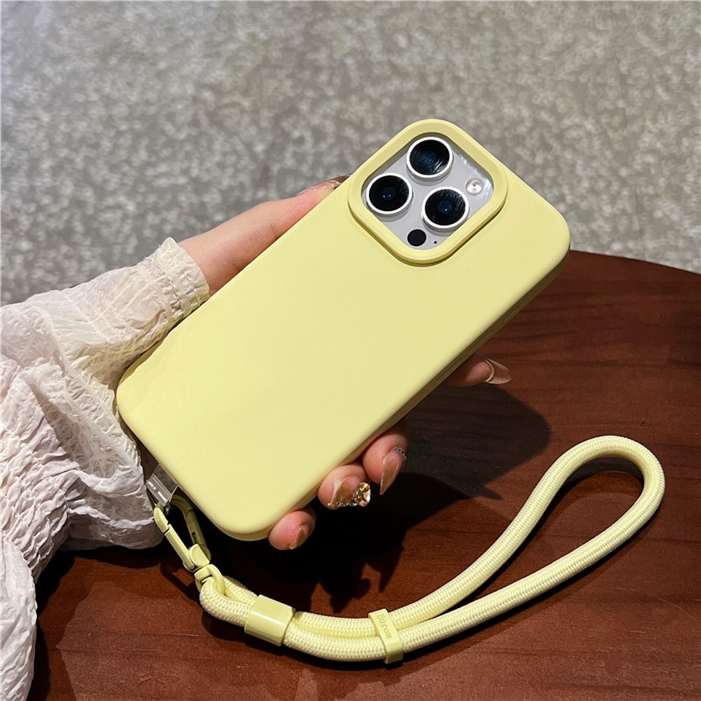 For iPhone 16 Pro Case Soft Microfiber Lining Liquid Silicone + PC Phone Cover with Wrist Strap - Light Yellow