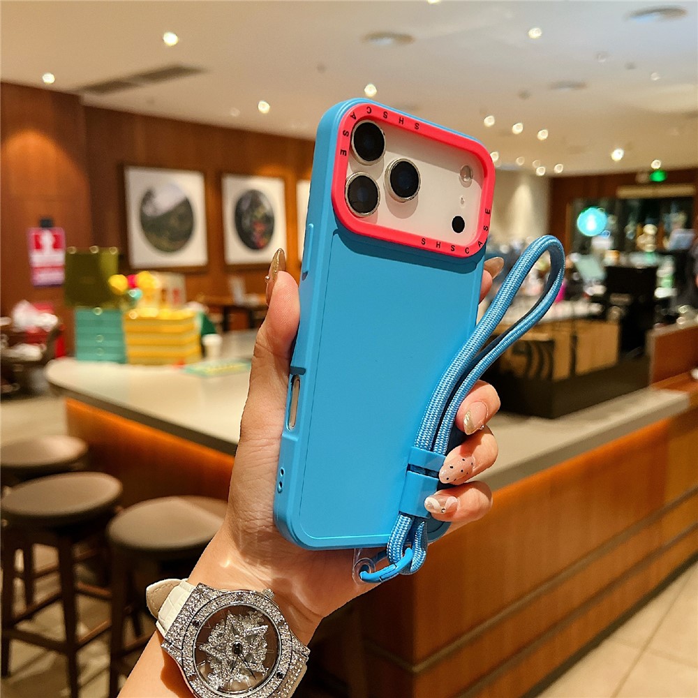 For iPhone 17 Pro Max Case Contrasting Colors Shockproof TPU Phone Cover with Wrist Strap - Baby Blue