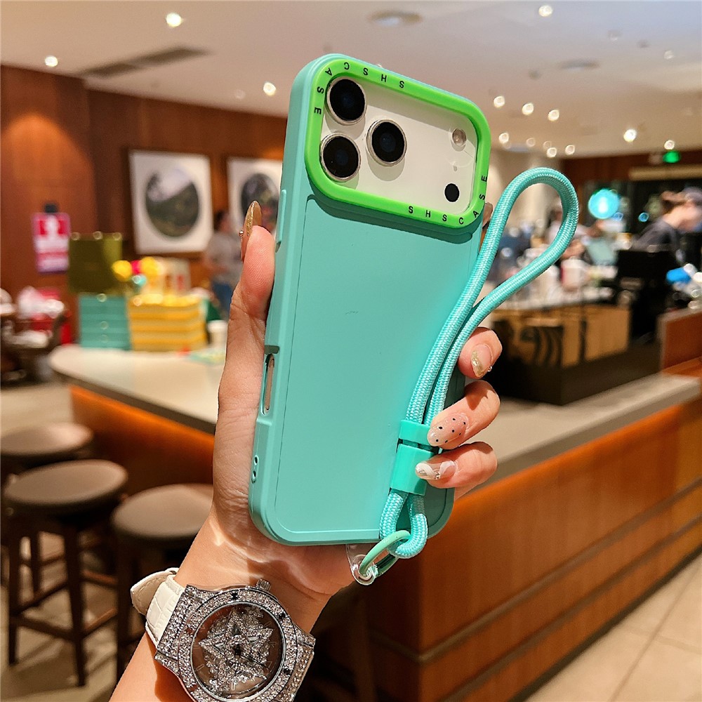For iPhone 17 Pro Max Case Contrasting Colors Shockproof TPU Phone Cover with Wrist Strap - Cyan