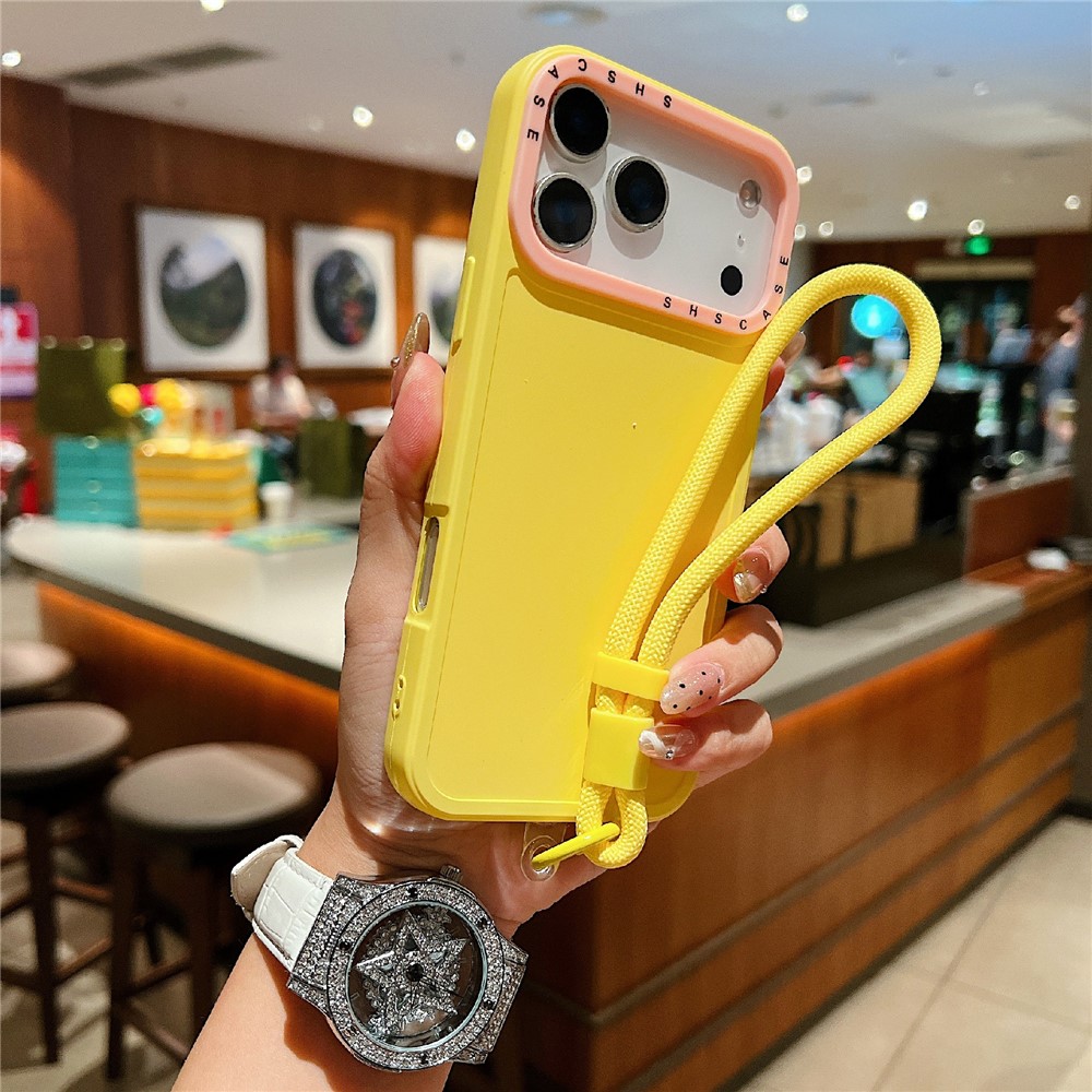 For iPhone 17 Pro Case Contrasting Colors Shockproof TPU Phone Cover with Wrist Strap - Yellow