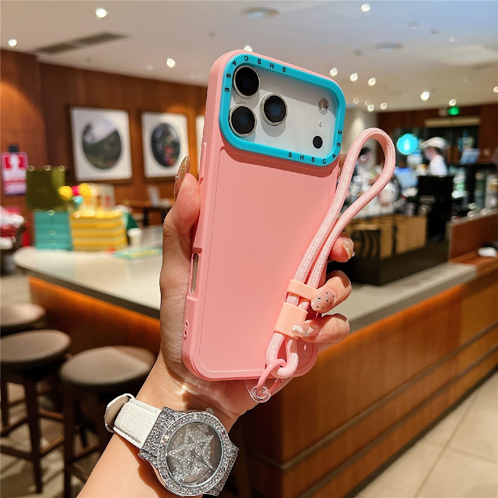 For iPhone 17 Pro Case Contrasting Colors Shockproof TPU Phone Cover with Wrist Strap - Pink