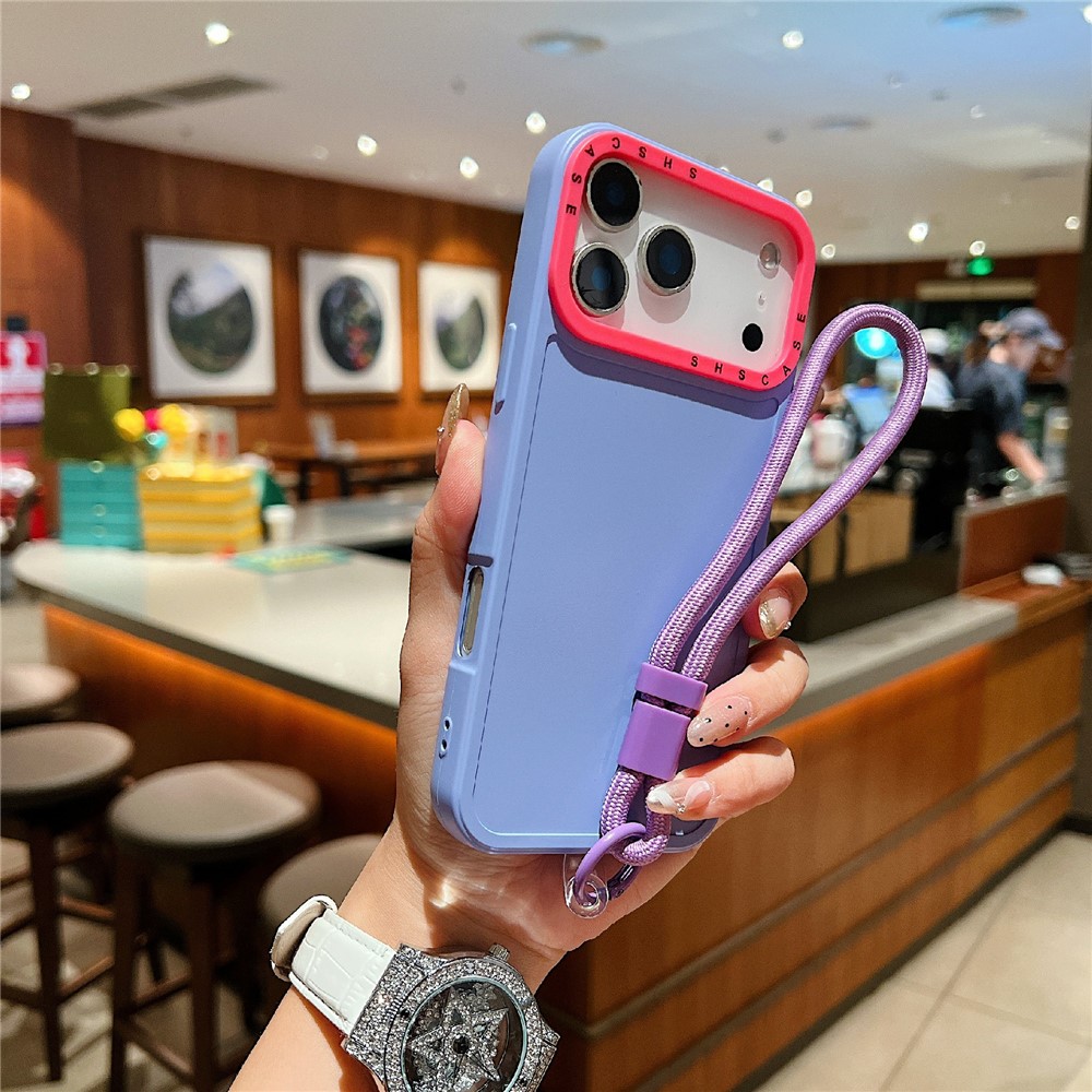 For iPhone 17 Pro Case Contrasting Colors Shockproof TPU Phone Cover with Wrist Strap - Purple
