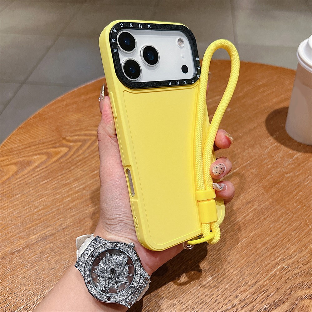 For iPhone 17 Pro Max Case Black Lens Frame Shockproof TPU PC Phone Back Cover with Wrist Strap - Yellow
