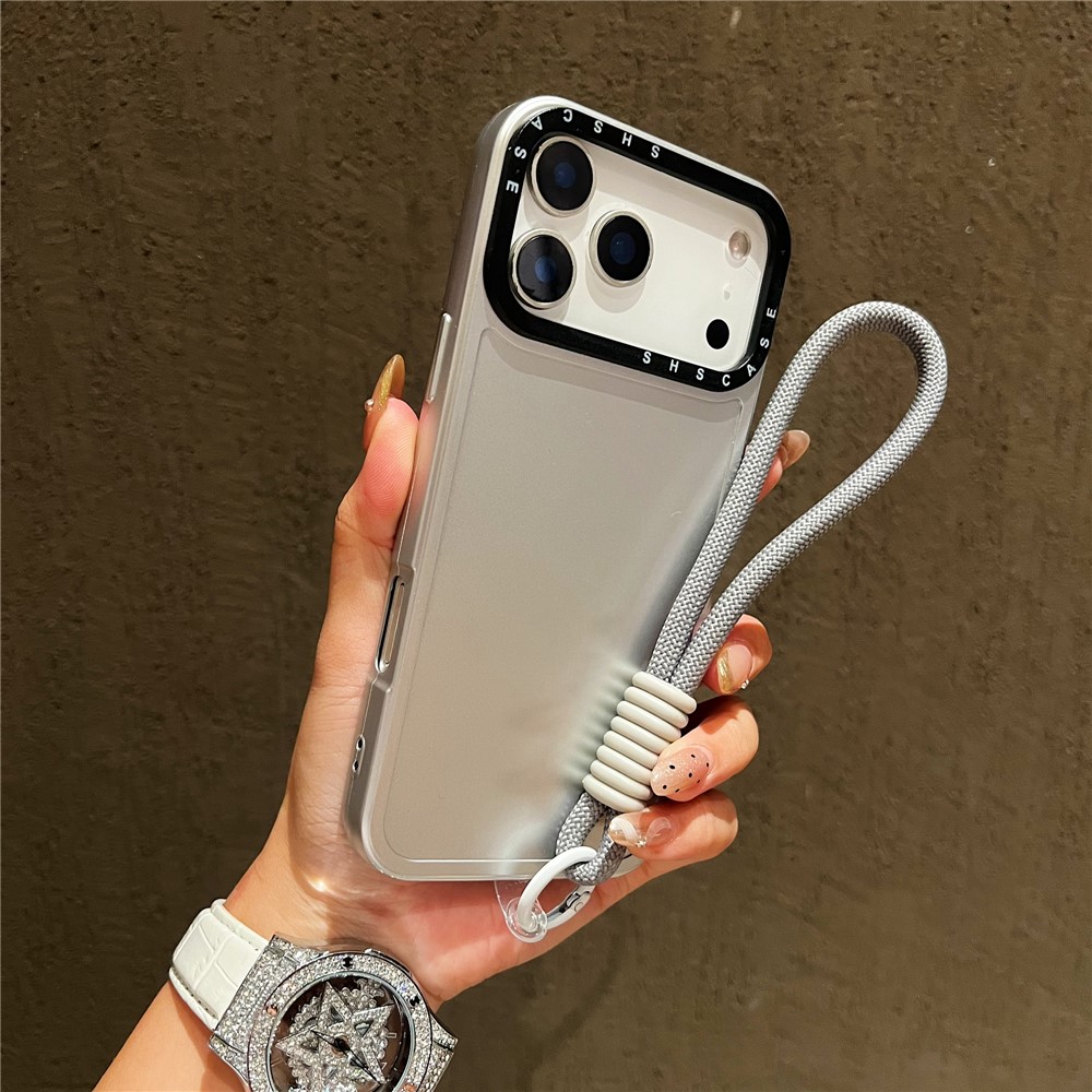 For iPhone 17 Pro Case Black Lens Frame Metal Paint Finish PC + TPU Phone Back Cover with Wrist Strap - Silver