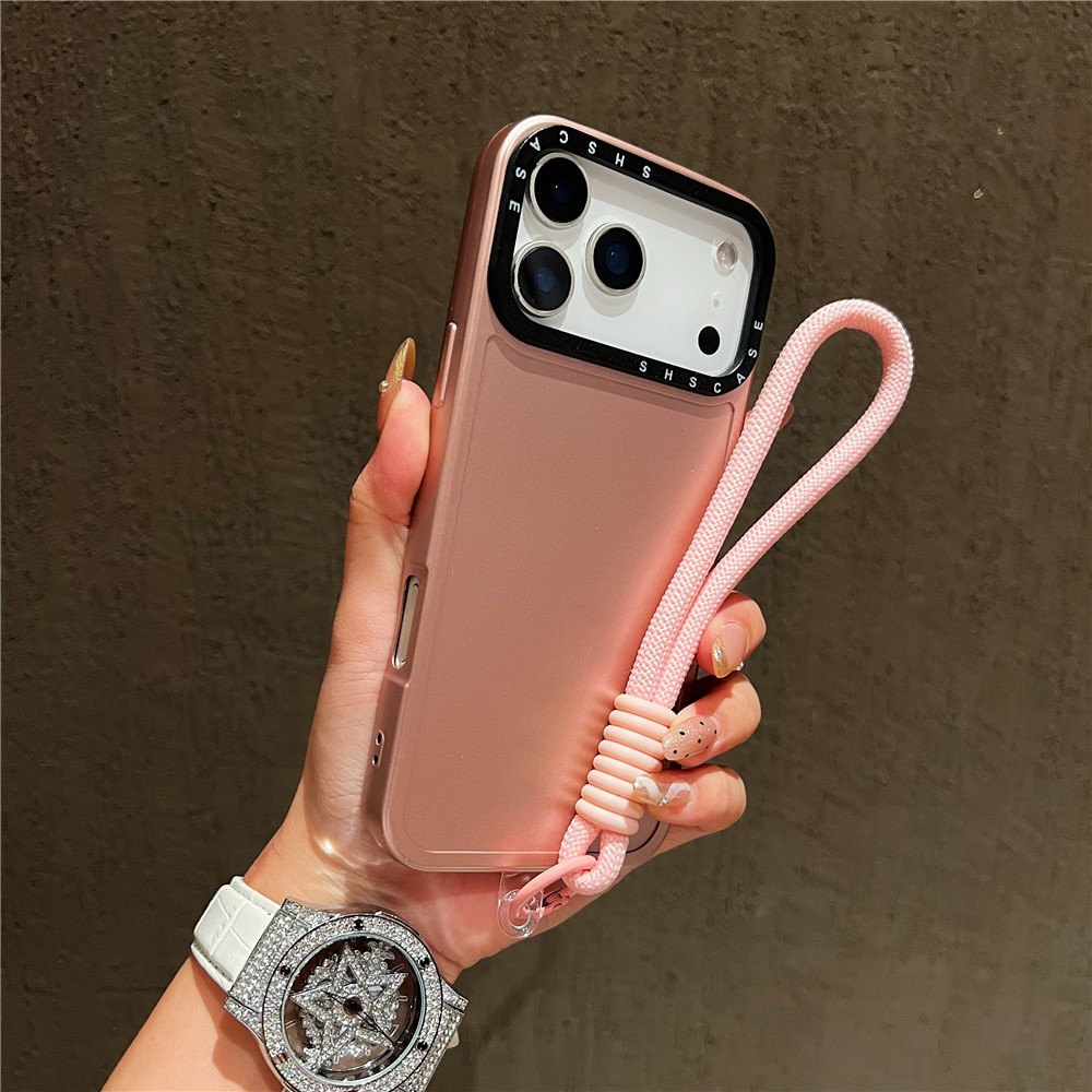For iPhone 17 Pro Case Black Lens Frame Metal Paint Finish PC + TPU Phone Back Cover with Wrist Strap - Rose Gold